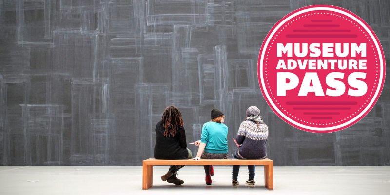 Photo of three people sitting on a bench facing an open exhibit wall with "Museum Adventure Pass" logo overlaid