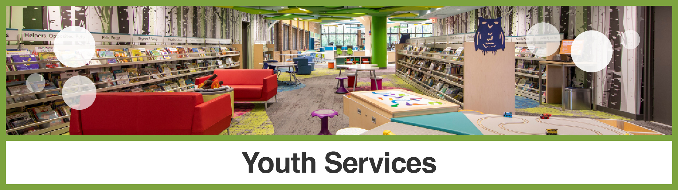 Interior photo of children's library shelves and furniture