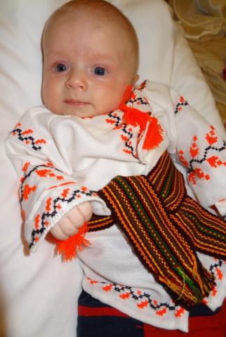 Picture of a baby in his embroidery shirt