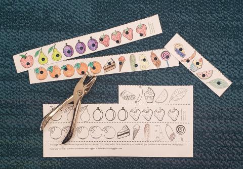 coloring pages with food, hole-punched as though by The Very Hungry Caterpillar; hole punch