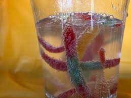 Gummy worms in a clear glass 